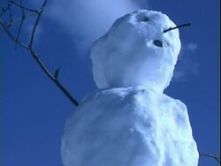 Snowman at blue sky background Stock Footage