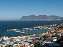 T/L Kalk Bay harbour and False Bay in Cape Town, South Africa Stock Footage
