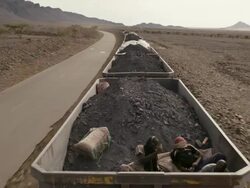 Mauritanian train carrying iron ore and passengers Stock Footage