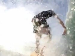 Breaking 20 foot wave crushes surfer in barrel Stock Footage