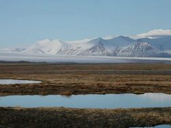 WS Snow covered mountain and fjallsjokull glacier are reflecting in lake / Iceland Stock Footage
