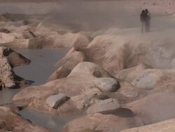 WS View of Geysers Sol de MaÃƒÂ±ana in south Bolivian desert with people in background / Uyuni , Bolivia Stock Footage