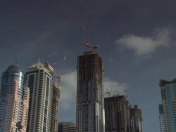 ZO Crane on top of a skyscraper under construction in the city / Dubai, United Arab Emirates Stock Footage