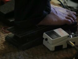 C/U bare foot of guitar player in a electric pedal  Stock Footage