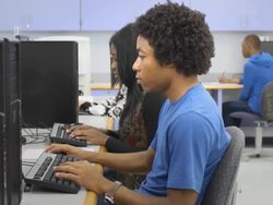 Male Student Works on Computer in Classroom Stock Footage