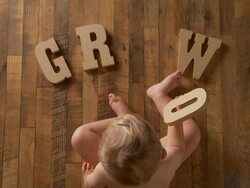 Baby spells "grow" Stock Footage