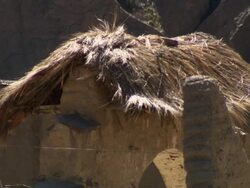 Small traditional straw roof dwelling in small rural town, Potolo, Bolivia Stock Footage