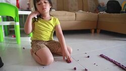 Dolly shot girl is playing dough in her house Stock Footage