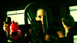 Female exercising on a bike Stock Footage