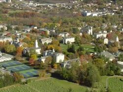MS AERIAL ZI ZO PAN View of Middlebury College and hockey ground in city / Vermont, United States Stock Footage