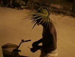 Man bike talks to tourists in Belize Stock Footage