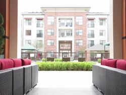 Couple running through outdoor seating area Stock Footage