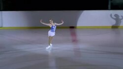 Female figure skater performing in short program Stock Footage