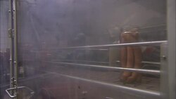 A conveyor belt behind a plastic screen moves jars of frankfurters. Stock Footage