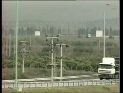 US military convoy on road near to port, more vehicles unloaded Instructional Video