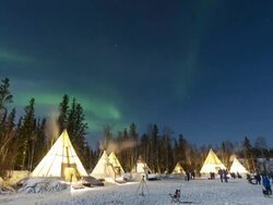 Night scenery of aurora polaris and teepees Stock Footage