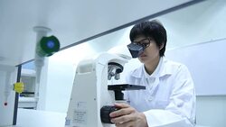Scientist using microscope Stock Footage