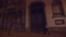 Graffiti covers overhead doors in Rio de Janeiro's Lapa neighborhood at night. Stock Footage