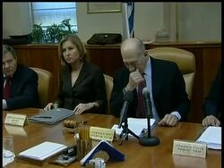 Aides say Israeli Prime Minister Ehud Olmert will officially resign this evening. He promised to step down immediately after his governing Kadima Party elected a leader to replace him. But he'll stay on as a caretaker until Foreign Minister Tzipi Livni puts together a coalition or elections are held. News Clip