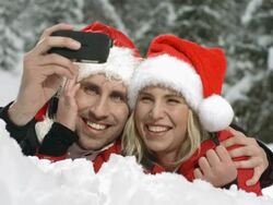 HD Super Slow-Mo: Xmas Couple Taking Photos With Mobile Phone Stock Footage