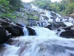 Large waterfall in forest,dolly shoot Stock Footage