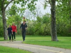 Family walks and talks together Stock Footage