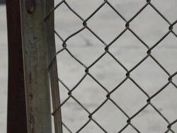 Locked Gate in front of Closed Factory Stock Footage