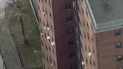 Aerial shot orbiting around one of the high rises of the Morrisania Houses, a low income housing project in the Bronx. Stock Footage