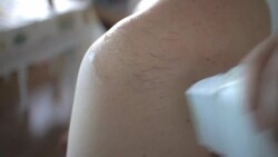 Male waxing with wax strips Stock Footage