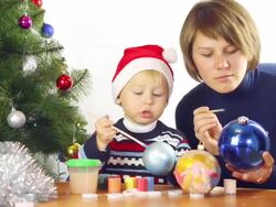 family paints Christmas toys Stock Footage