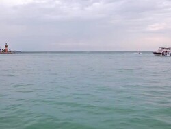 Seascape with lighthouse and boats Stock Footage