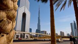 Highway along Dusit Thani Hotel and Burj Khalifa Stock Footage