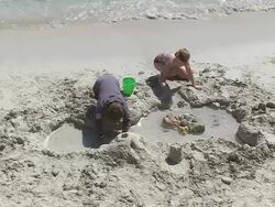MS Children playing at beach in holiday / Puerto Pollenca, Mallorca, Balearic Islands, Spain Stock Footage