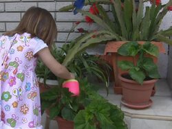 Watering girl (HD) Stock Footage