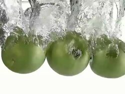 CU SLO MO Granny Smith Apples (malus domestica) entering water / Vieux Pont, Normandy, France  Stock Footage