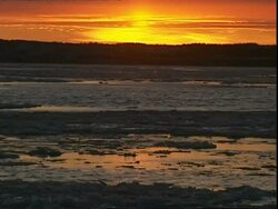 Sunrise over melting ice Stock Footage