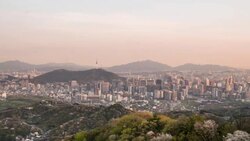 Day and night view of Gwanghwamun area from Mt. Bugak Stock Footage
