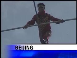 Legendary Uighur tightrope walker Adili Wushouer broke the Guinness World Record for steel wire walking at the Bird's Nest Stadium in Beijing. News Clip