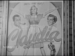 1948: CLAUDIA HISTORY: MOVIES: WS Movie posters for 'Claudia' 1943 film & sequel 1946 'Claudia & David' CU Poster. Men shopping at counter, CU Paperback 'Pocketbook' Claudia books on display rack, female hand picking up book. Instructional Video