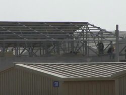 MS Construction workers working on roof / Musa Qala, Helmand Province, Afghanistan. Stock Footage