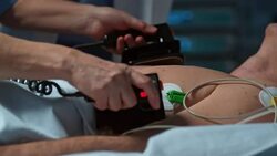 Manually ventilating a patient during resuscitation with defibrillator Stock Footage