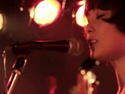 Female Bass guitarist singing and playing on stage. Stock Footage