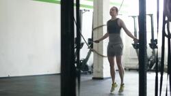 Crossfit athlete woman jumping rope Stock Footage