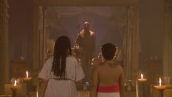 Cleopatra and Ptolemy walk down a candlelit aisle. Stock Footage