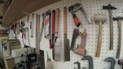 Craftsman standing against the wall Stock Footage