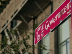 A panel of street name English/ Chinese Stock Footage
