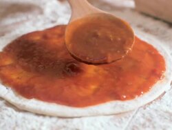 Smart camera movement over tomato sauce on pizza base Stock Footage