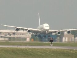 AirbusA380 SuperJumbo Jet Airplane Landing Closeup on a hot day Stock Footage