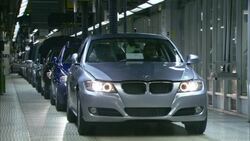 A BMW drives off the assembly line in an automobile factory. Stock Footage