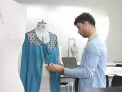 Male Fashion Designer working in studio Stock Footage